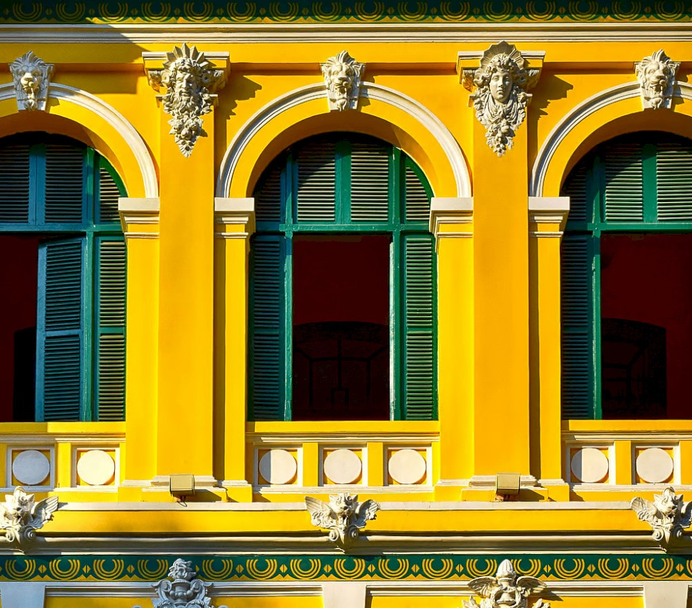 The blue windows, paired with the yellow paint, create an impressive contrast